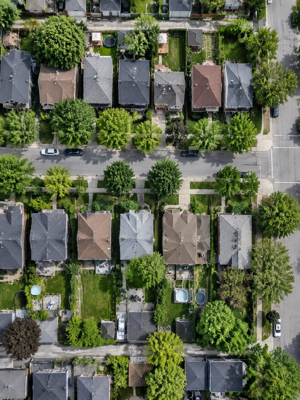 Aerial view of rooftops and streets in a residential neighborhood